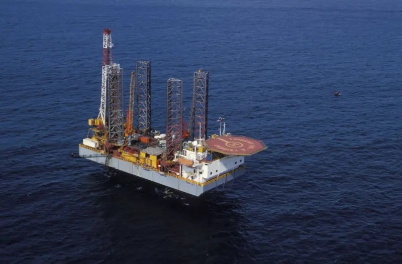 Before: the rig, three legs set on the seabed